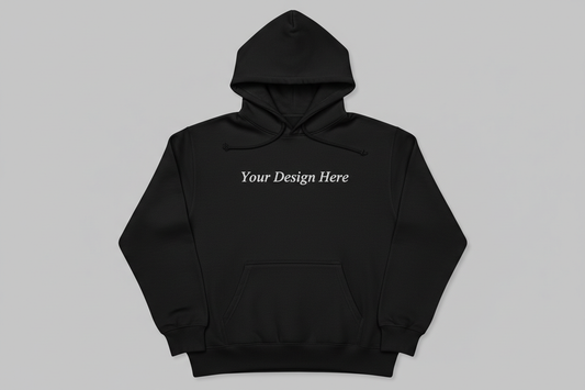 Black hoodie with centered “Your Design Here” text for custom embroidery or DTF printing, offered by Sharp Stitch USA; great for corporate apparel, staff uniforms, small business branding, or personalized gifts.