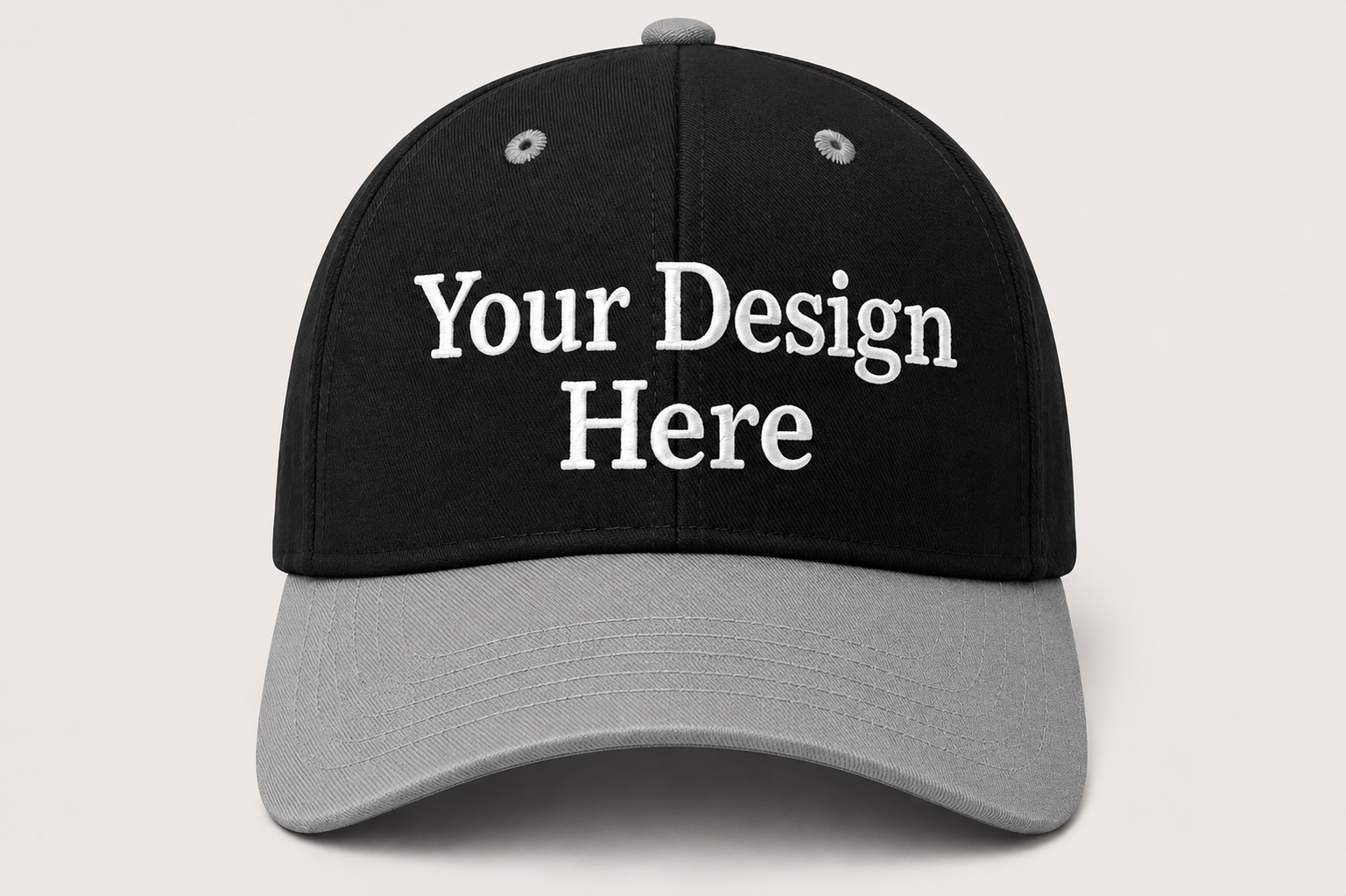 Black and gray cap with 'Your Design Here' text on a light gray background