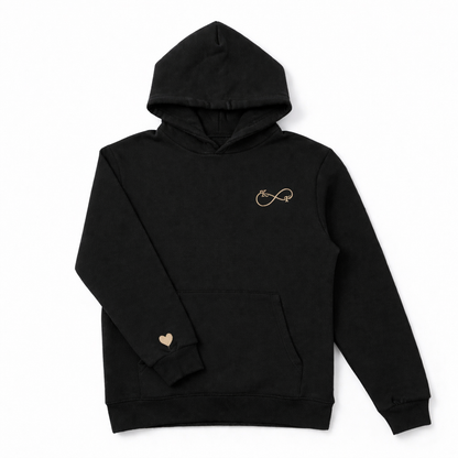 Black unisex hoodie with beige infinity embroidery and custom initials, premium embroidery by Sharp Stitch in Niles IL, available for nationwide U.S. shipping.