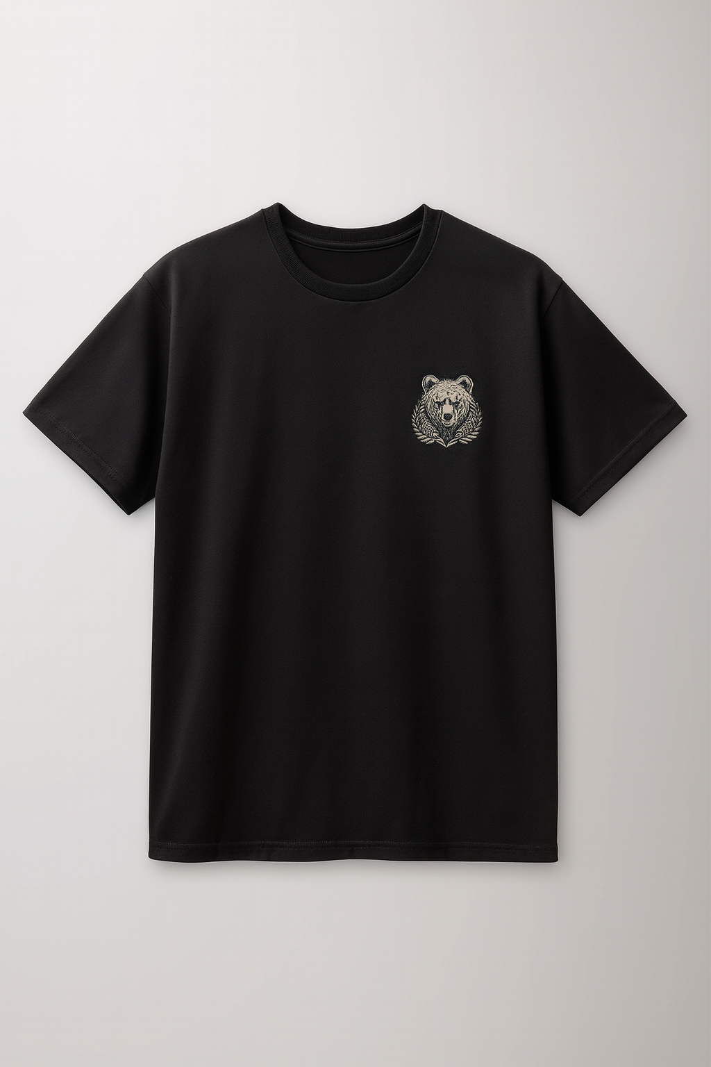 Black t-shirt with a bear emblem on a light gray background. Custom DTF Print and Custom Embroidery 

