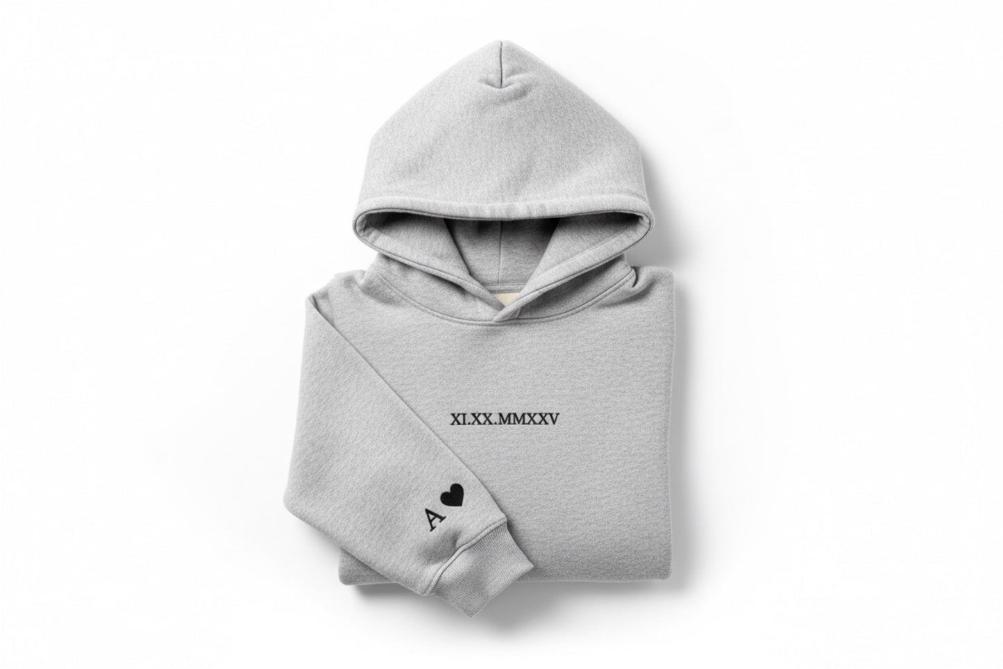 Grey couples embroidered hoodie with black thread by Sharp Stitch, featuring roman numeral embroidery on the chest and initials with a heart embroidered on the sleeve. High quality custom embroidery for hoodies and crewneck sweatshirts, ideal for casual wear, work uniforms, and everyday apparel, with nationwide USA shipping.