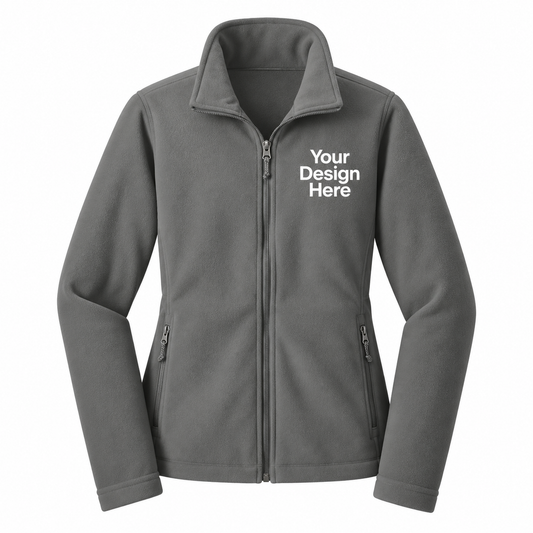 A dark gray zip-up fleece jacket with a mock neck collar, featuring the white text 'Your Design Here' printed on the left chest, displayed on a solid white background.

