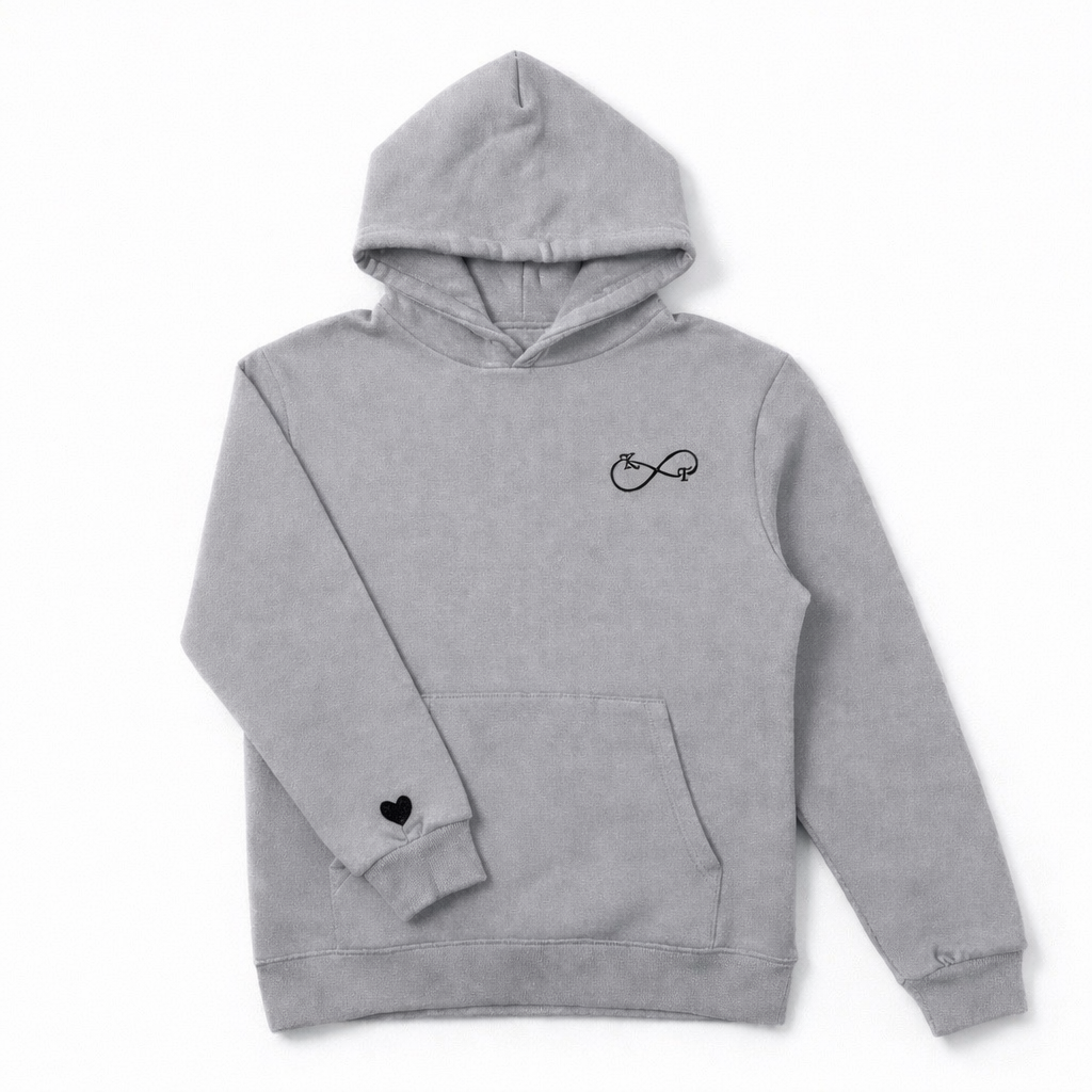 Grey couples hoodie with black embroidered infinity initials and heart sleeve detail, professionally embroidered by Sharp Stitch, serving Illinois and customers across the United States.