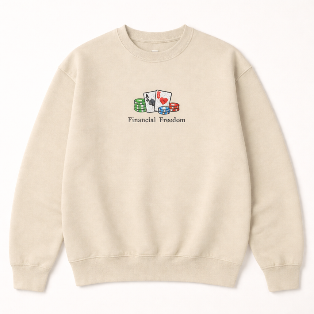 Beige crewneck sweatshirt featuring a minimalist embroidered design of playing cards, poker chips, and Financial Freedom text
