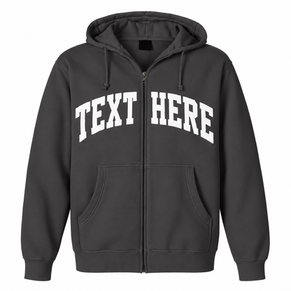 A dark gray zip-up hoodie with 'TEXT HERE' printed in white arched block letters across the chest, shown on a plain white background.

