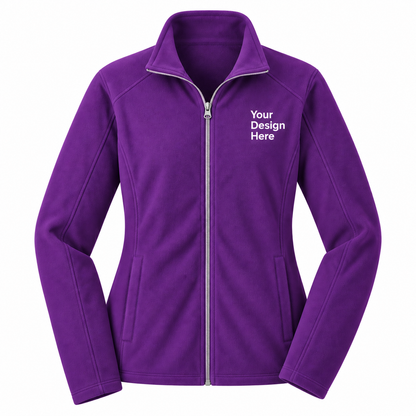 A purple full-zip fleece jacket with a stand-up collar, shown on a plain white background. The left chest features white placeholder text reading 'Your Design Here'.

