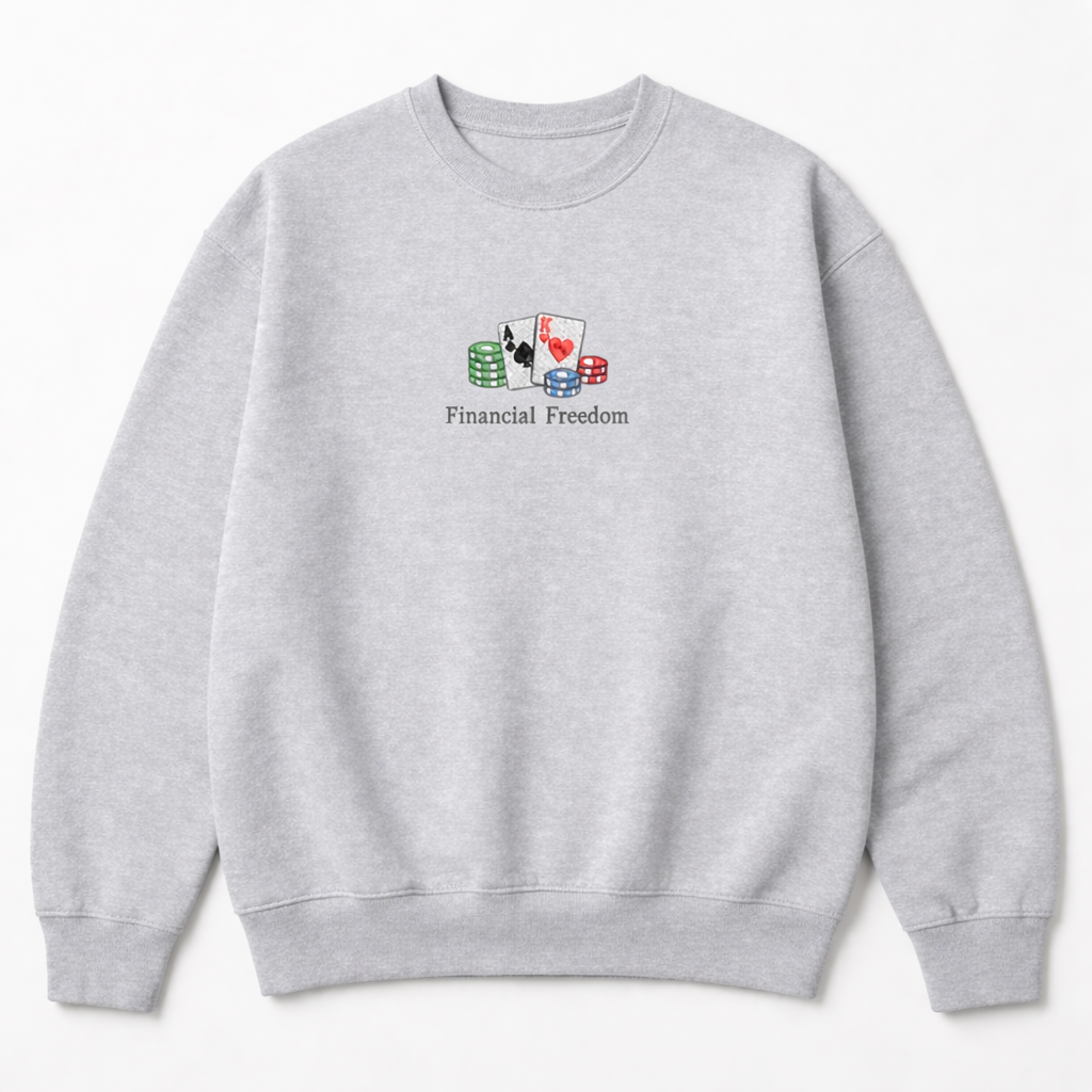 Grey crewneck sweatshirt with a small chest embroidery of playing cards, poker chips, and Financial Freedom text in a clean design