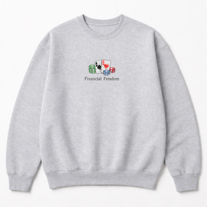 Grey crewneck sweatshirt with a small chest embroidery of playing cards, poker chips, and Financial Freedom text in a clean design