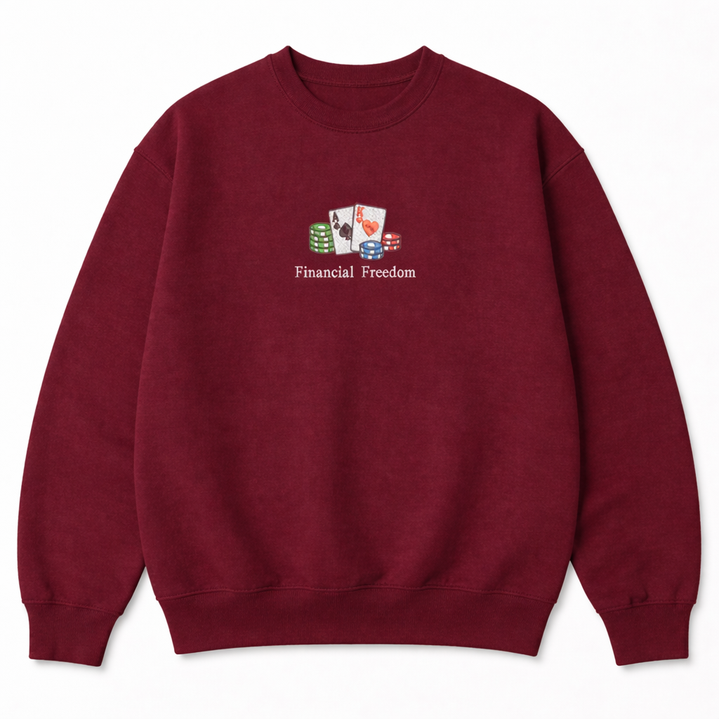 Maroon crewneck sweatshirt with a small embroidered design of playing cards, poker chips, and Financial Freedom text on the chest