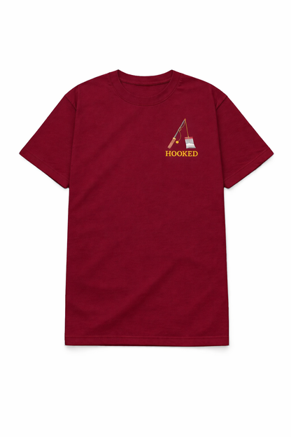 Maroon t shirt with a small chest DTF printed fishing rod design and Hooked text