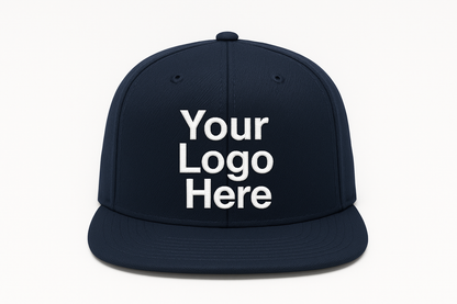 navy blue snapback flat brim cap, facing forward, with the text: "Your Logo Here" on the cap embroidered