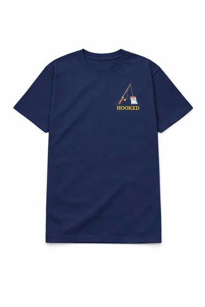 Navy blue t shirt featuring a small chest DTF print of a fishing rod with the word Hooked