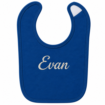 A royal blue baby bib with the name 'Evan' embroidered in white script across the center, shown on a plain white background.

