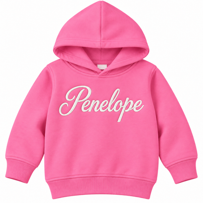 A bright pink children's pullover hoodie with the name 'Penelope' printed across the chest in white cursive script, shown against a plain white background.

