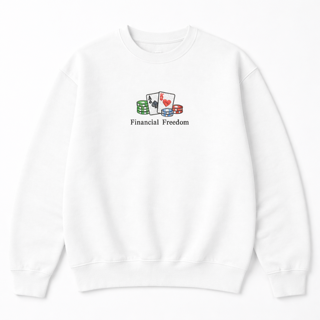 White crewneck sweatshirt with a small embroidered design of playing cards and poker chips with Financial Freedom text on the chest