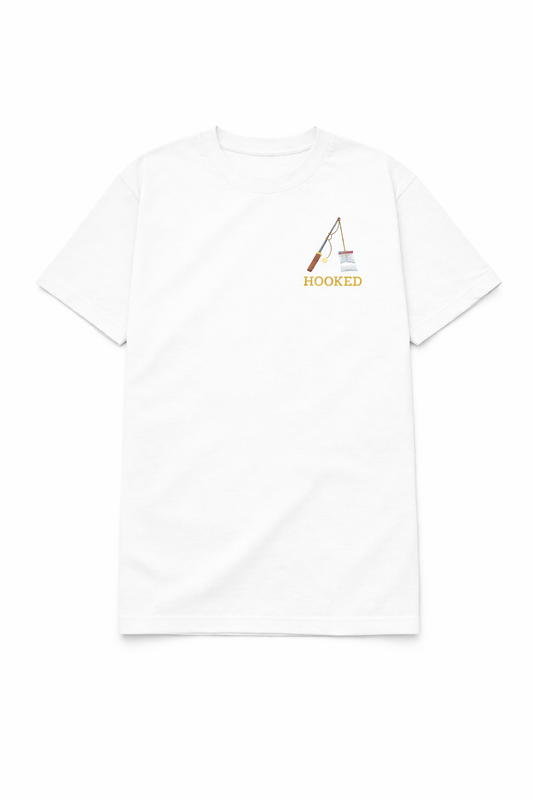 White t shirt featuring a small chest DTF print of a fishing rod with the word Hooked in a clean minimalist design